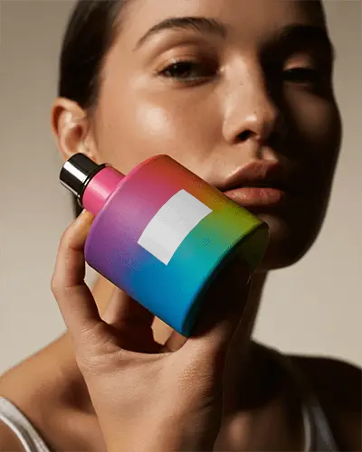 Vibrant Rainbow Perfume Mockup Held Close To Face With Soft Warm Studio Lighting