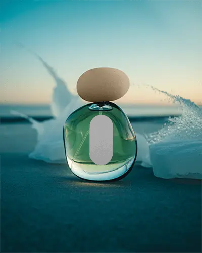 Serene Coastal Perfume Mockup With Organic Stone Cap And Splashing Waves At Sunrise
