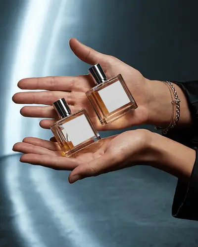 Hand Held Perfume Mockup Dual Square Glass Bottles Soft Cinematic Light Luxury Style