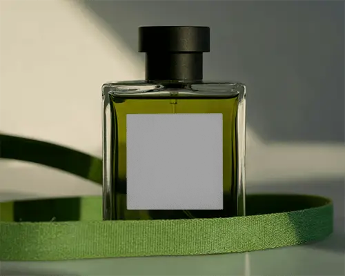 Green Perfume Mockup Square Glass Bottle With Fabric Ribbon Natural Light Studio Scene