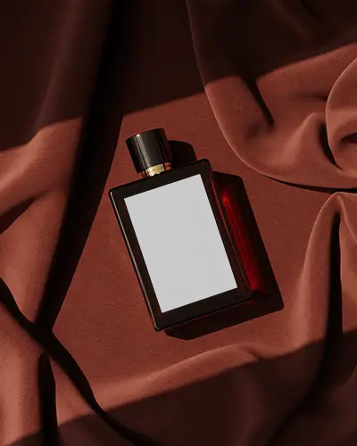 luxury-perfume-bottle-mockup-lying-on-rich-red-fabric-with-soft-shadows-premium-stylish-display