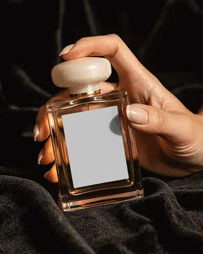Luxury Perfume Bottle Mockup Hand Holding Glass With Ivory Cap On Black Velvet Luxury Display