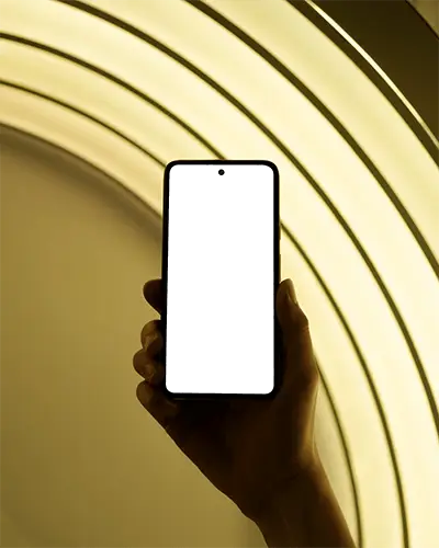 Sleek Modern Android Phone Mockup In Hand Against Light Arc Background For Digital Showcase