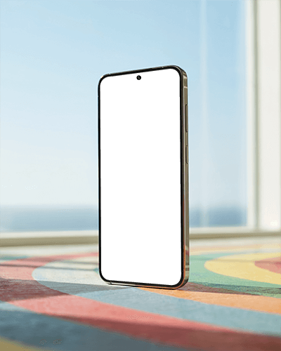 Sleek Minimalist Phone Mockup Standing On Colorful Patterned Table With Sunny Background