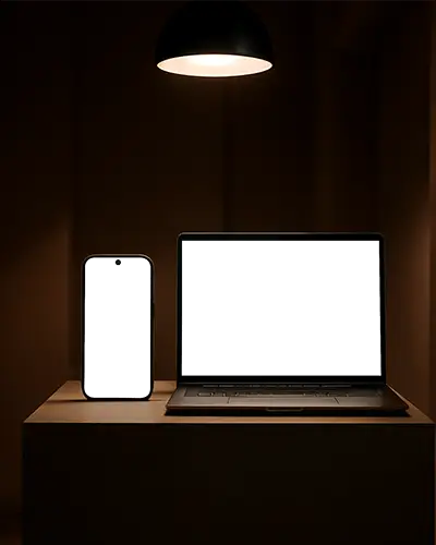 modern-smartphone-and-laptop-mockups-on-minimalist-desk-under-indoor-lighting