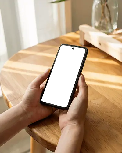 realistic-android-phone-mockup-closeup-view-hands-holding-minimalistic-theme-wooden-surface