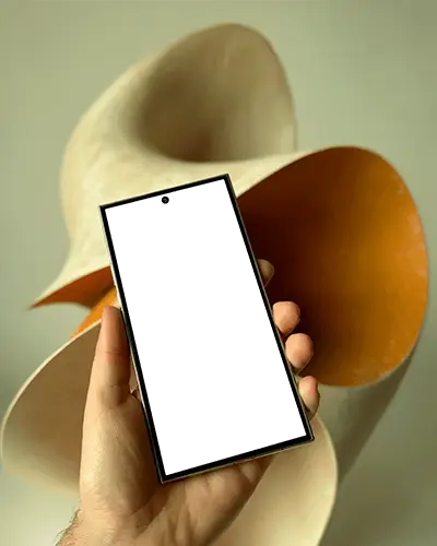 realistic-samsung-s25-ultra-android-phone-mockup-handheld-device-against-modern-abstract-sculpture