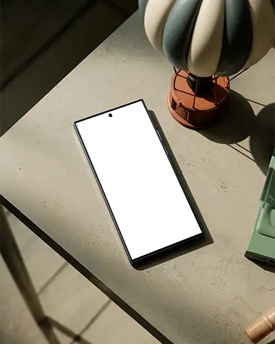 Samsungs25ultra Top View Smartphone Mockup Positioned Next To Decorative Hot Air Balloon Model