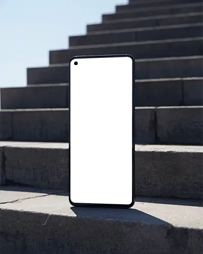 Oneplus Sleek Vertical Phone Mockup Standing On Outdoor Stairs With Blank Screen Space