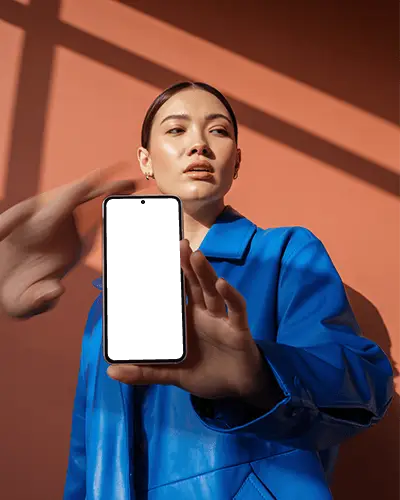 Bold Fashion Google Pixel Smartphone Mockup Female Model Holding Phone With Blue Coat And Dramatic