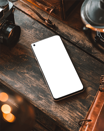 Flat Lay Vintage Smartphone Mockup On Wooden Desk With Retro Camera And Soft Lighting