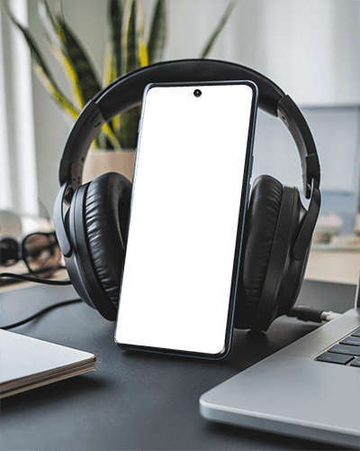 Modern Desk Smartphone Mockup With Headphones And Laptop In Clean Creative Workspace