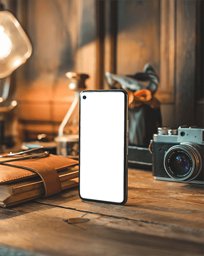 Vintage Desk Smartphone Mockup Standing On Wooden Surface With Camera And Notebooks