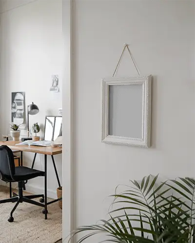 photoframe-mockup-with-vintage-artwork-frame-on-wall-clean-modern-workspace-inspiration-corner-with-earthy-element