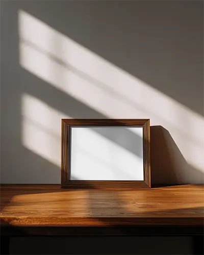 minimalistic-frame-mockup-positioned-against-plain-wall-with-sunlight-shadow-play