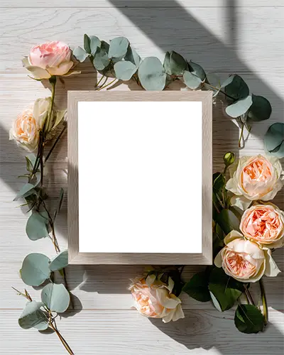floral-frame-mockup-with-delicate-roses-and-eucalyptus-leaves-on-wooden-background