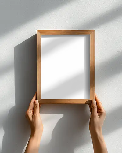 wooden-frame-mockup-in-hands-against-plain-background-for-custom-art-display