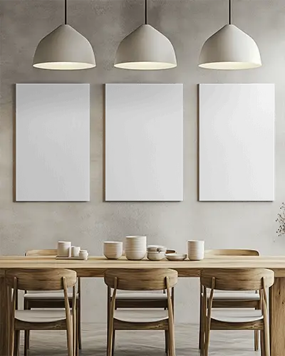 Three Blank Wall Canvas Mockup Hanging Above Wooden Dining Table With Contemporary Chairs