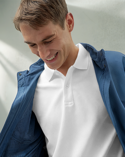 Stylish Casual T Shirt Mockup Smiling Male Model In Peach Polo Light And Modern Vibe