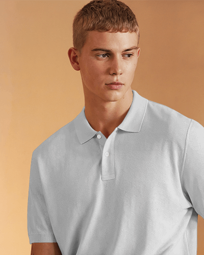 Vibrant Polo T Shirt Mockup Male Model In Deep Blue Against Warm Beige Background Playful And Modern Style