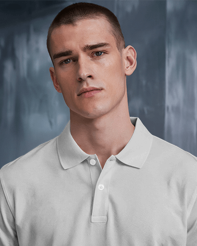 Classic Polo Shirt Mockup Male Model Moody Blue Background Elegant And Minimalist Look