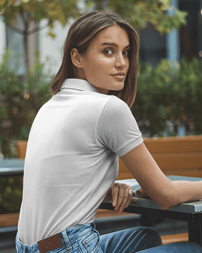 Modern Blank White Women Polo T Shirt Mockup Female Model Sitting Outdoors In Casual Setting