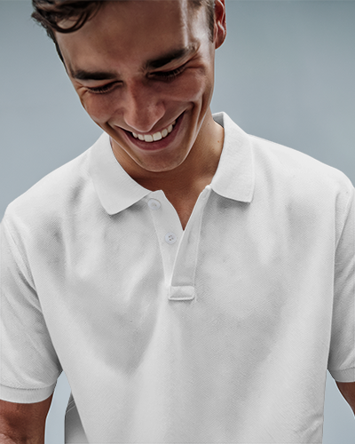 Casual Polo Shirt Mockup Smiling Male Model In Black Polo With Great People Design Against Soft Blue Background Relaxed And Friendly Look