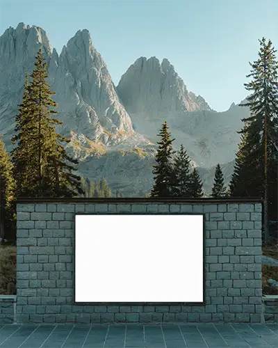 Outdoor Stone Wall Poster Mockup With Mountain Background And Tall Pine Trees