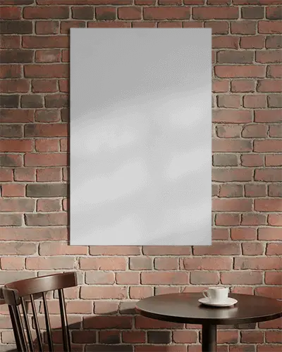 Modern Cafe Interior With Brick Wall And Poster Mockup Above Round Table Setting