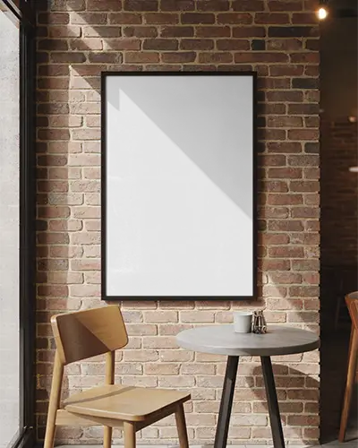 Minimalist Poster Mockup On Exposed Brick Wall With Modern Cafe Chair And Table Setting
