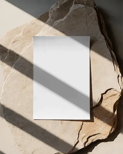 Natural Light Poster Mockup On Rough Stone Textured Surface For Design Presentation