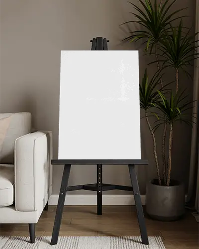 interior-room-poster-mockup-design-black-easel-floor-standing-next-to-sofa-and-plants