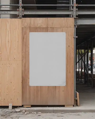 urban-construction-area-poster-mockup-displaying-blank-marketing-design-on-wooden-panel