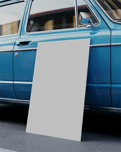 freestanding-poster-mockup-leaning-against-vintage-car-side-for-street-promotion