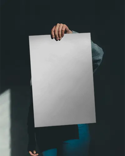 Person Displaying Blank Vertical Poster Mockup For Advertising Design
