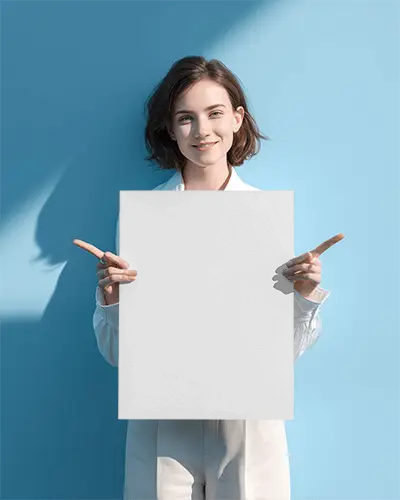 Woman Holding Blank Poster Mockup In Studio Background Pointing Sideways For Advertising
