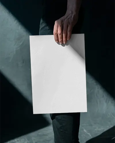 Person Holding Empty Vertical Poster Mockup For Design Presentation Or Marketing