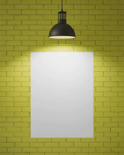 Wall Mounted Blank Poster Mockup With Glowing Wall Lamp On Rough Brick Background