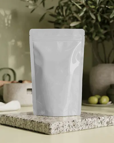 Glossy Pouch Mockup On Granite Block In Kitchen Setup With Olive Tree Natural Light And Shadows