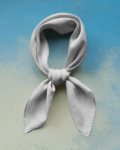 premium-scarf-mockup-stylish-fabric-knot-on-studio-surface-with-painted-backdrop