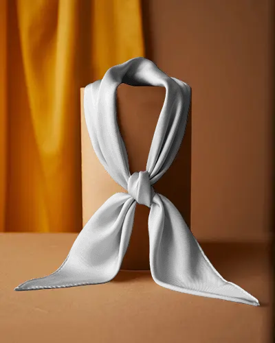 Elegant Scarf Mockup Knotted On Minimal Display Stand With Yellow Curtain Backdrop In Studio
