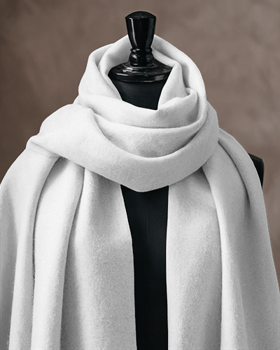 classic-elegant-scarf-mockup-white-scarf-draped-on-black-mannequin-against-neutral-textured-background-sophisticated-and-timeless-look