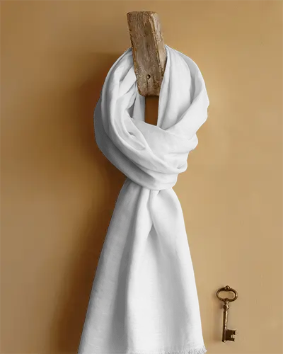 rustic-wall-mounted-scarf-mockup-looped-on-wooden-hook-with-shadow-play-and-vintage-metal-key-detail