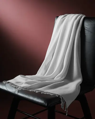 elegant-scarf-mockup-draped-on-chair-with-deep-burgundy-gradient-background
