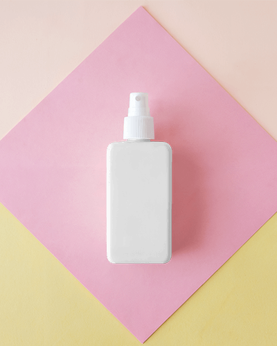 minimalist-spray-bottle-mockup-on-pastel-pink-and-yellow-background-clean-and-modern-cosmetic-packaging