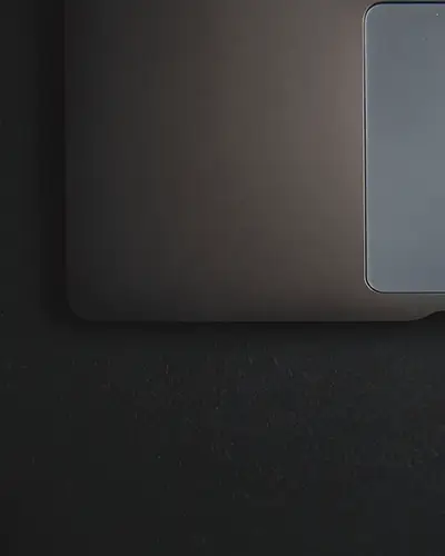 Top View Laptop Sticker Mockup Centered Design On Dark Surface Minimal Modern Tech Setup 0101