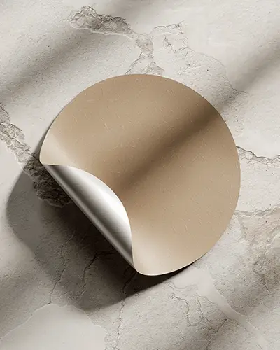 Curled Edge Circle Sticker Mockup On Textured Marble Surface With Natural Shadowing Minimalist And Realistic Presentation 0131