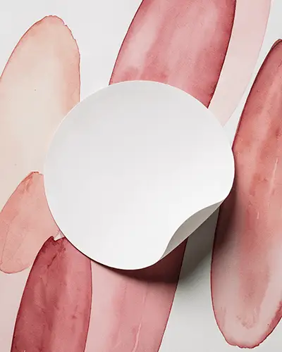 Curled Edge Circle Sticker Mockup On Watercolor Brushstroke Background Soft Shadows Artistic And Creative Vibe 0132