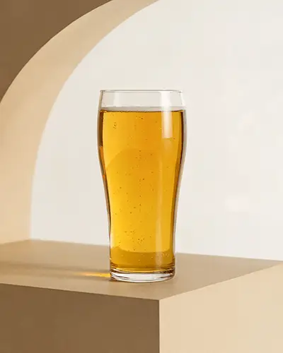 Tall Glass Drink Sticker Mockup On Angled Platform With Modern Arched Background 0175