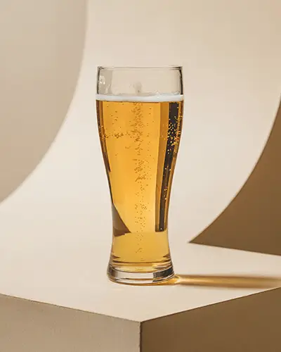 Clear Glass With Sparkling Drops Sticker Mockup Under Gentle Illumination On Sophisticated Stand 0176